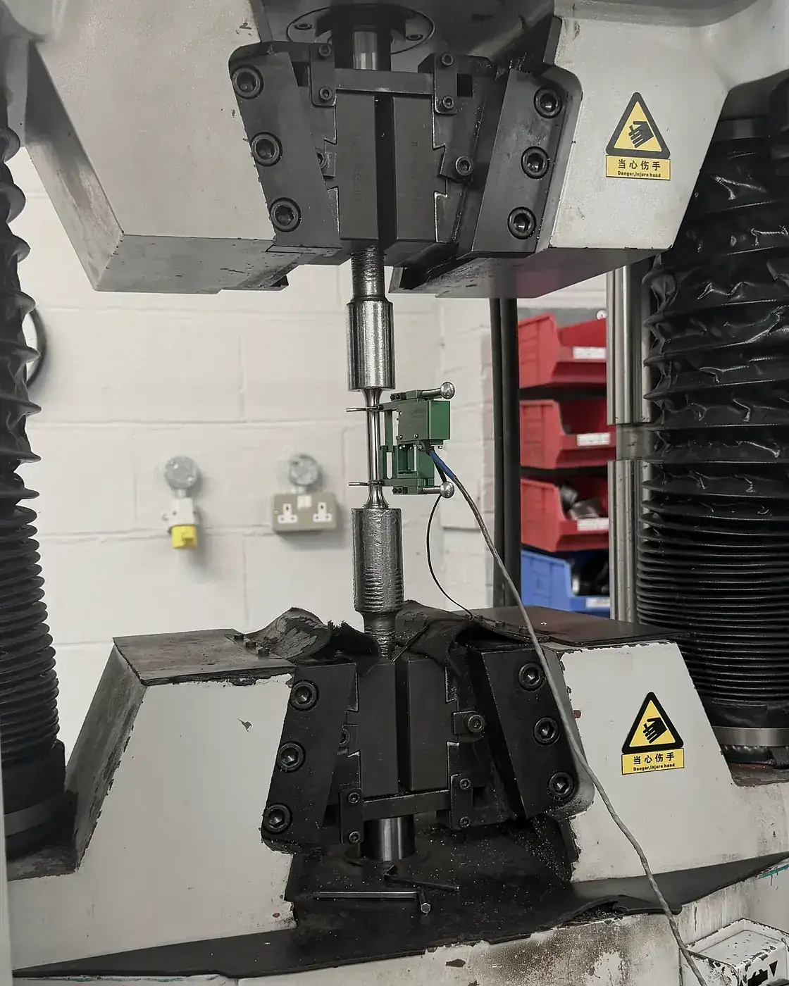 Tensile test of a machined test piece with an extensometer fitted